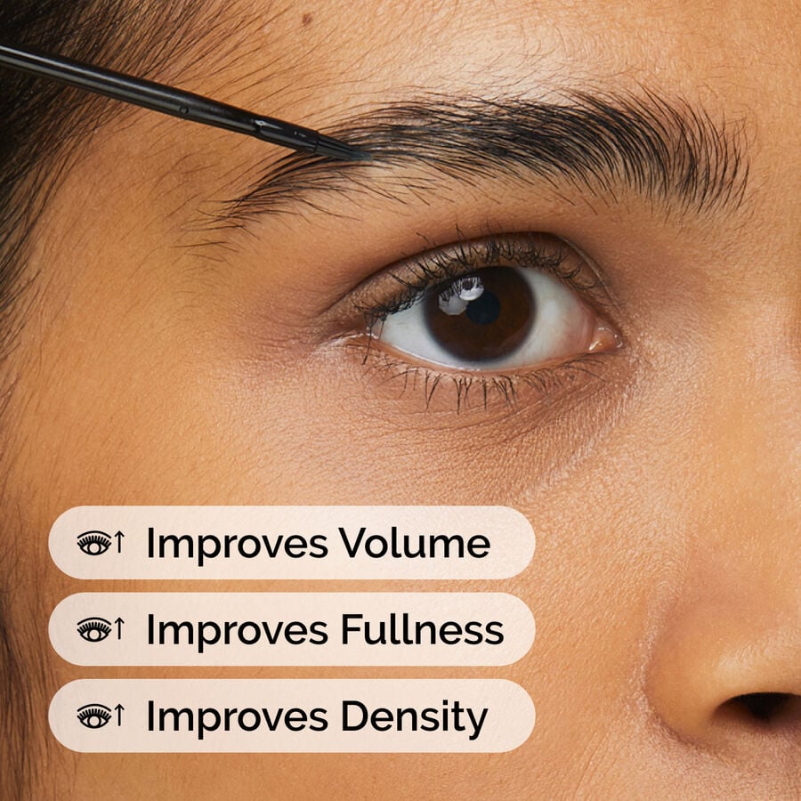Applying Multi-Peptide Lash and Brow Serum to the brow for improved volume, fullness, and density